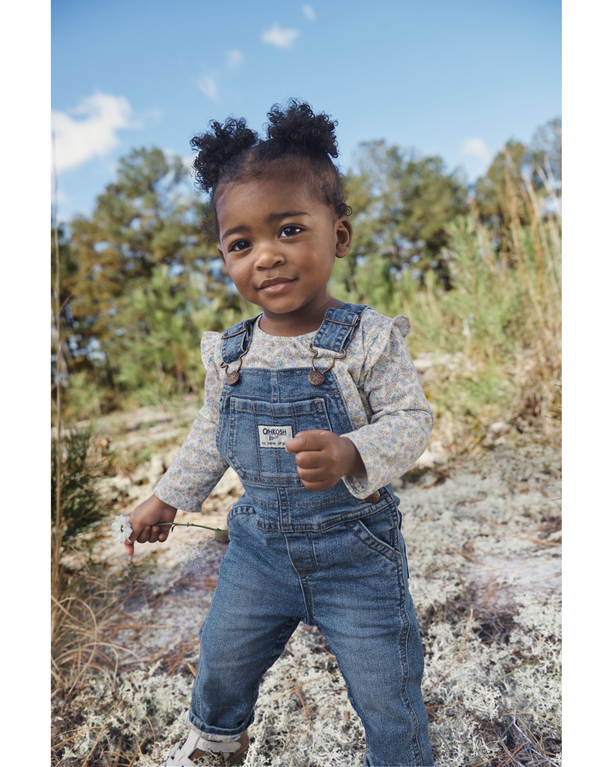 Little girl wearing sales overalls
